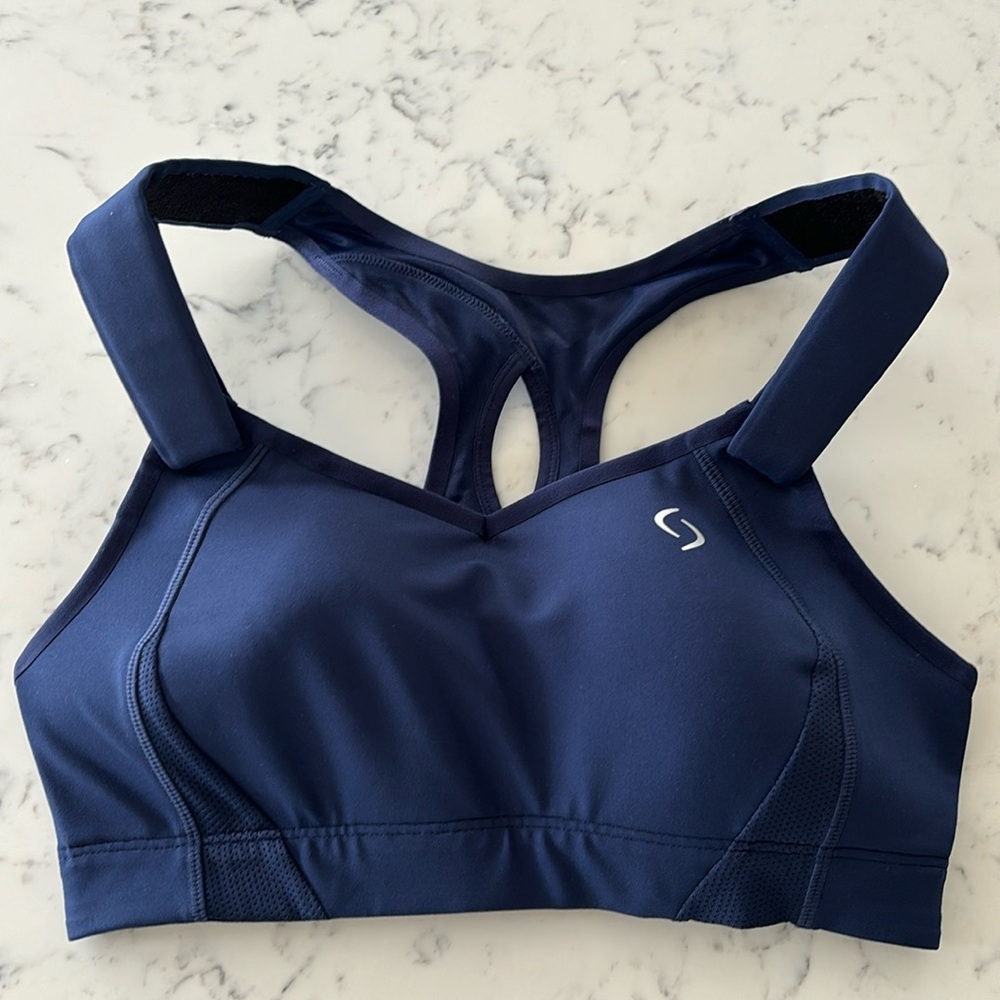New without tags Moving comfort 32 C sports bra. Navy blue.